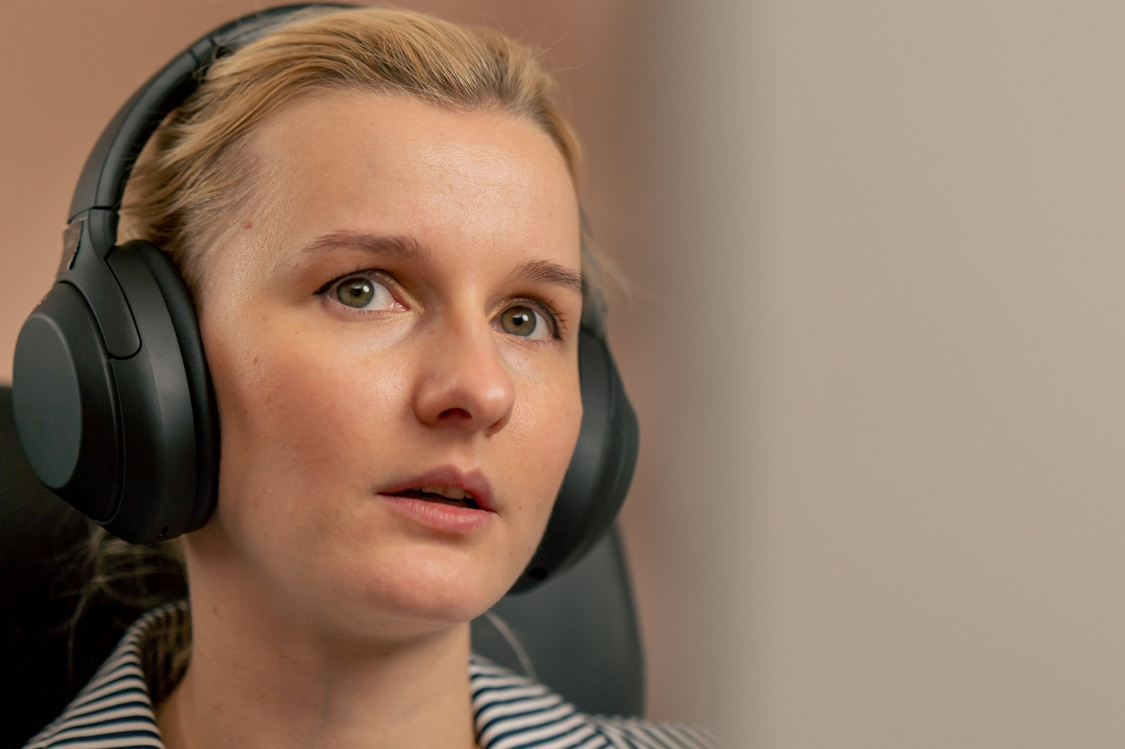 Woman wearing headphones during an EMDR session