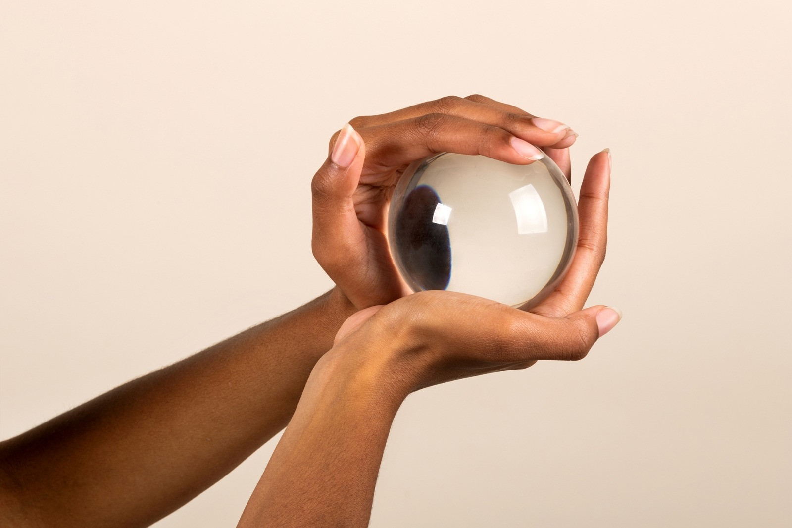 Hands holding a crystal ball, symbolizing uncertainty and anxiety about test outcomes
