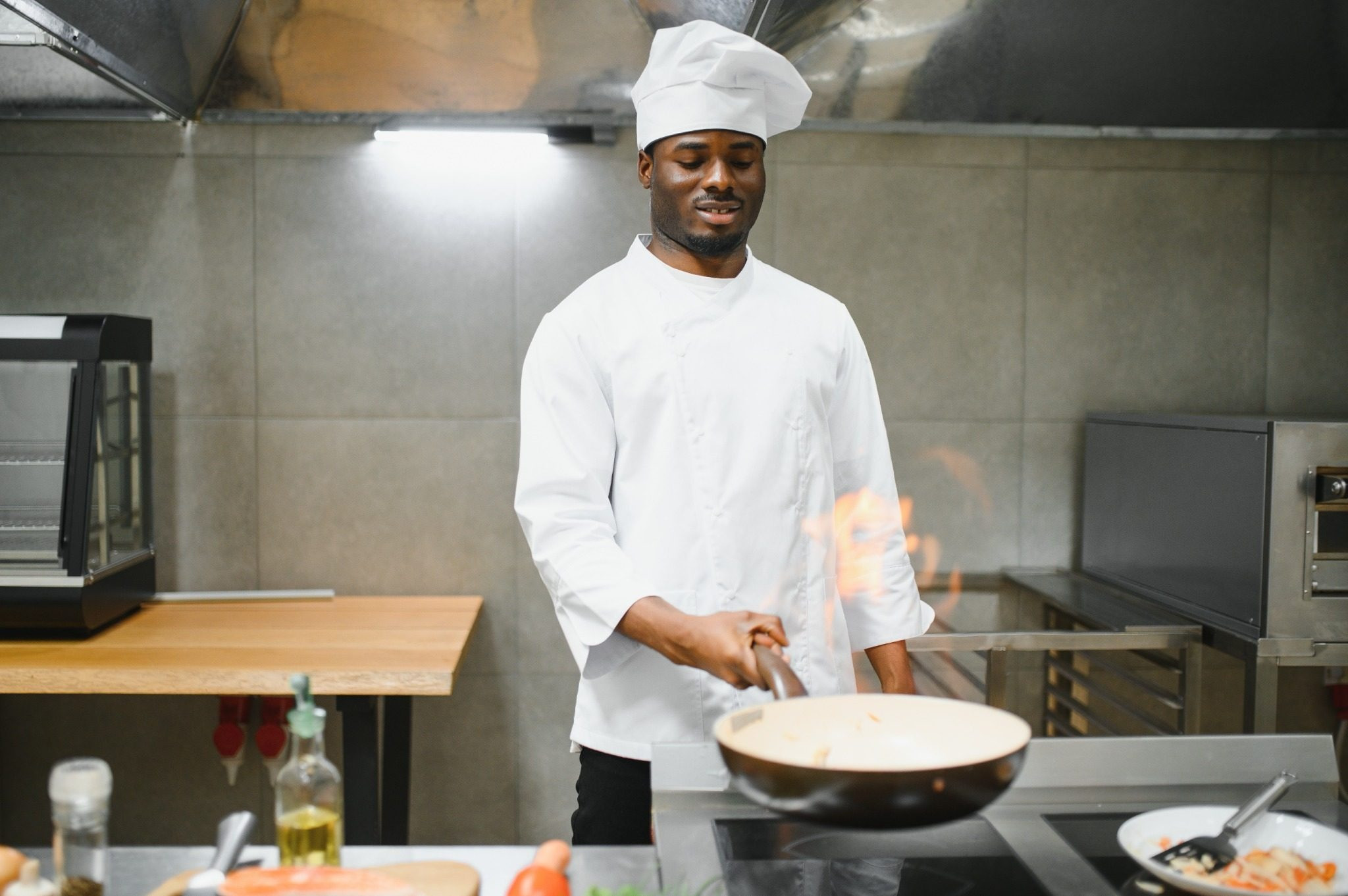 Chef cooking in a professional kitchen during a busy workday