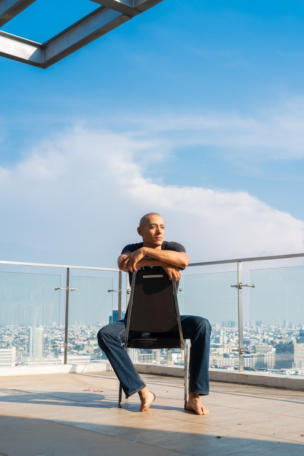 Man sitting outdoors reflecting on grief and loss