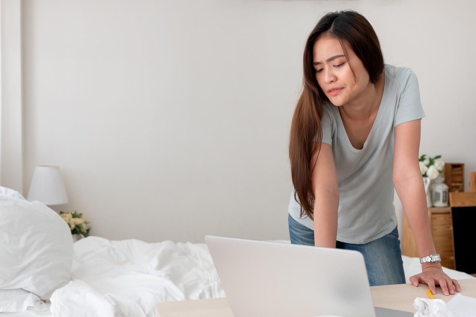 Woman taking a break while using a laptop during an EMDR session